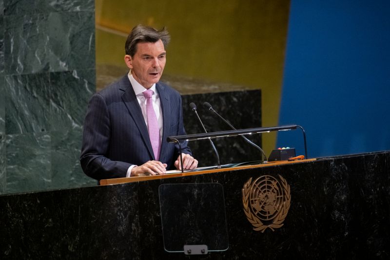 Ambassador James Larsen speaking behind a podium at the United Nations General Assembly.