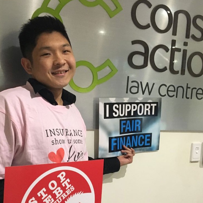 Meng is holding a sign that reads: I support fair finance