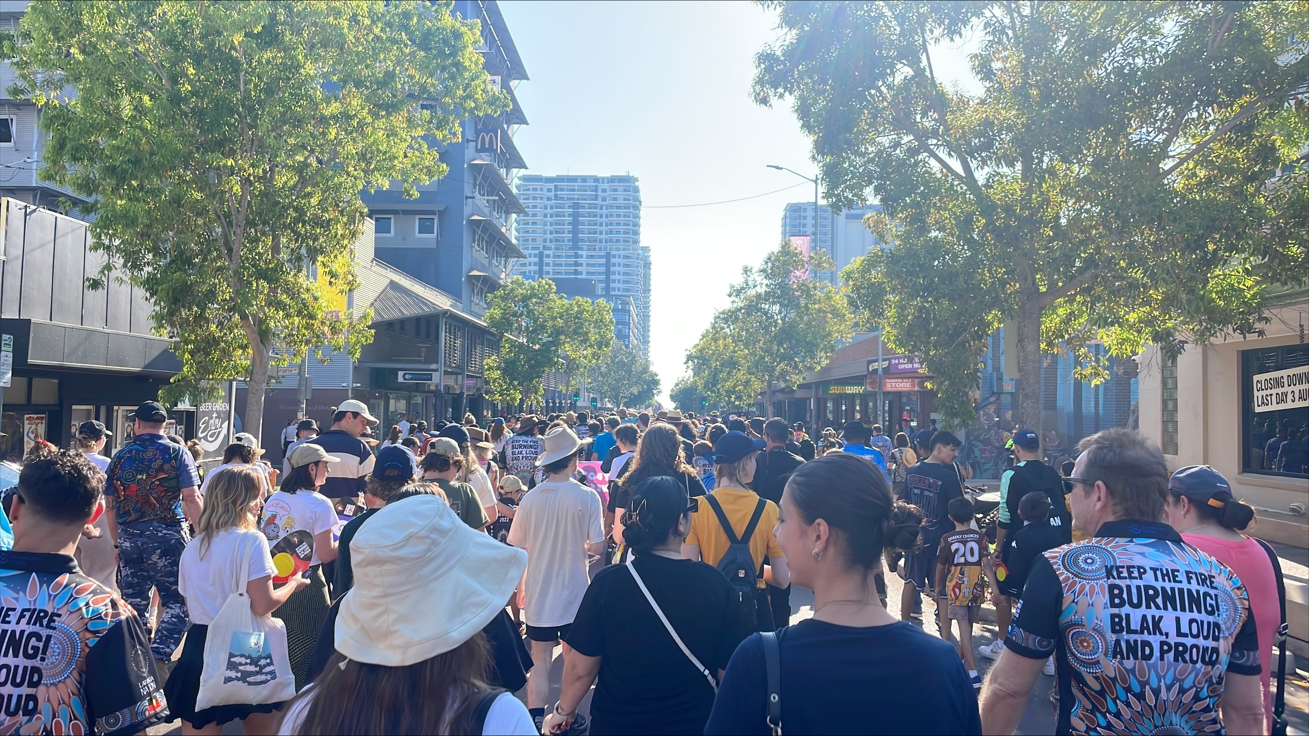 People march through the streets of Darwin