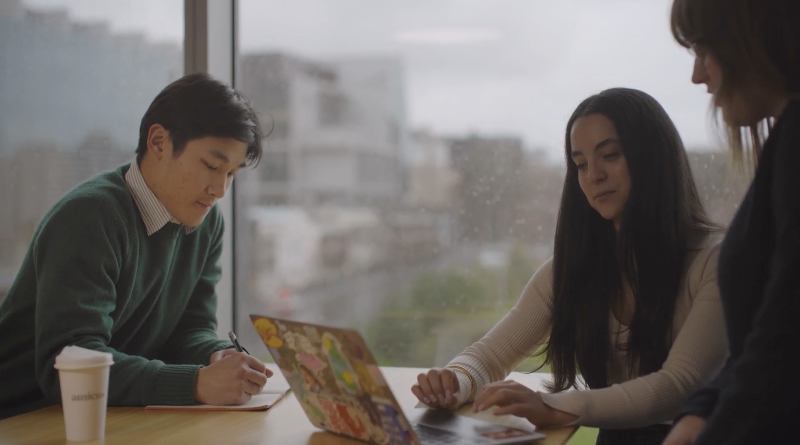 Justin Leung studying with friends at the MLS Library