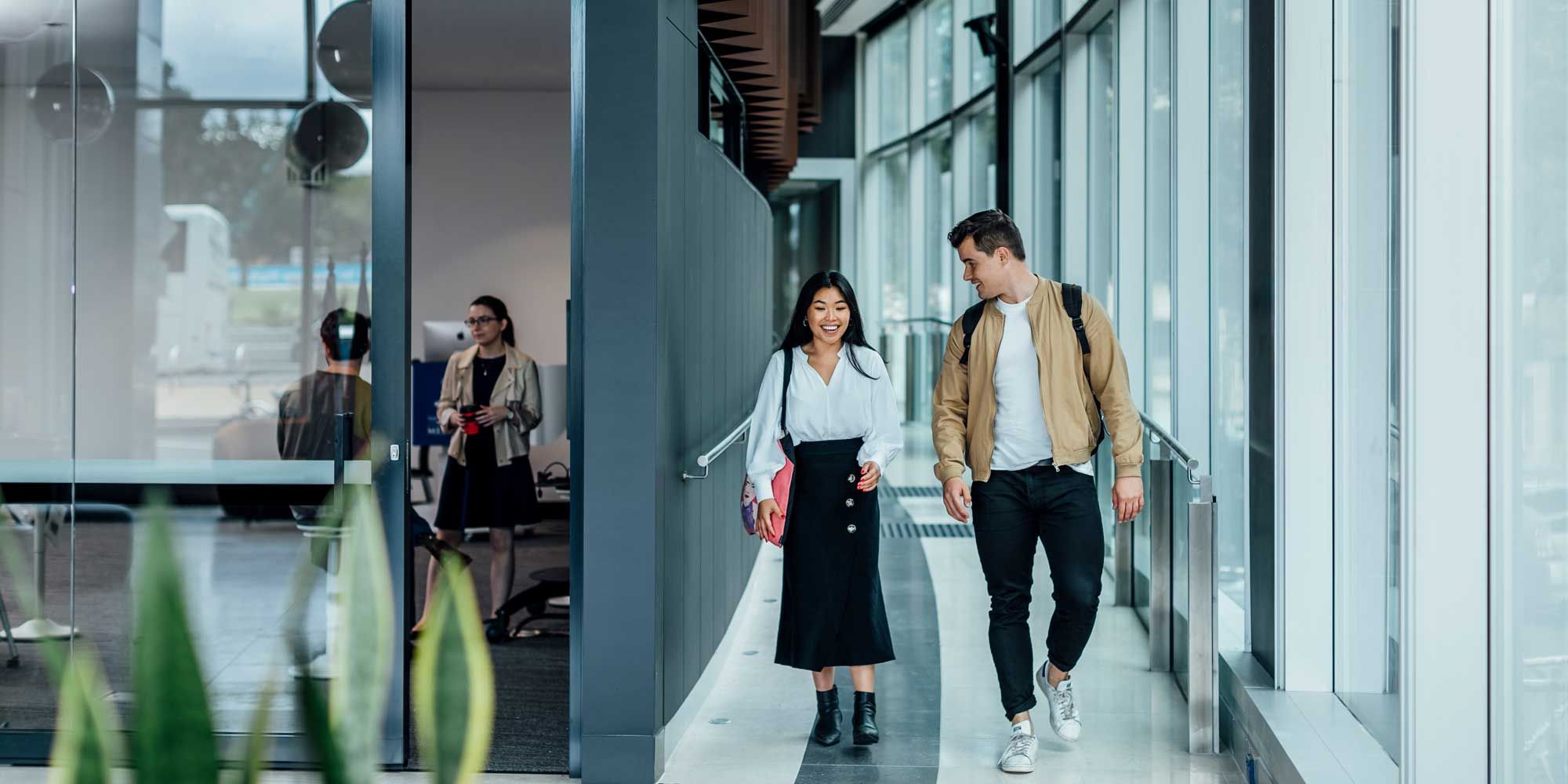 Students walking inside the Law School Building