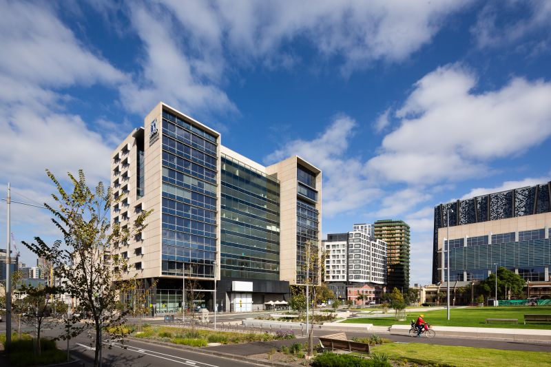 The MLS building is shown at a 3/4 angle from the left, with blue sky in the background.