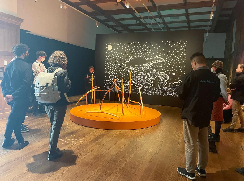 Group of people looking at art installation