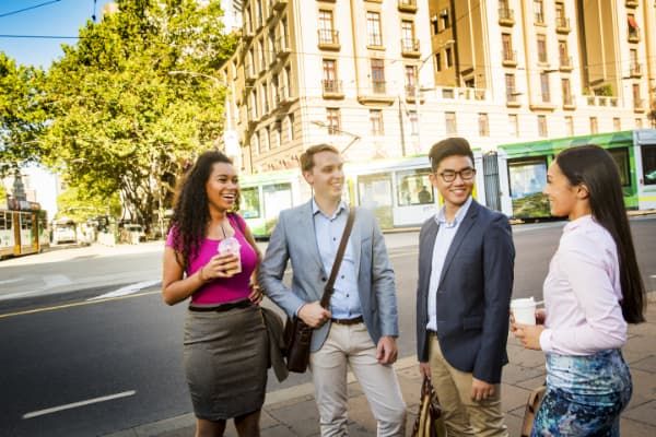 four students, Collins Street, Melbourne CBD
