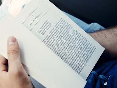 Close up of person holding open a book